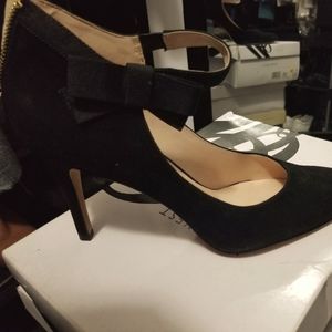 Suede zipper up heels with bow detail on side